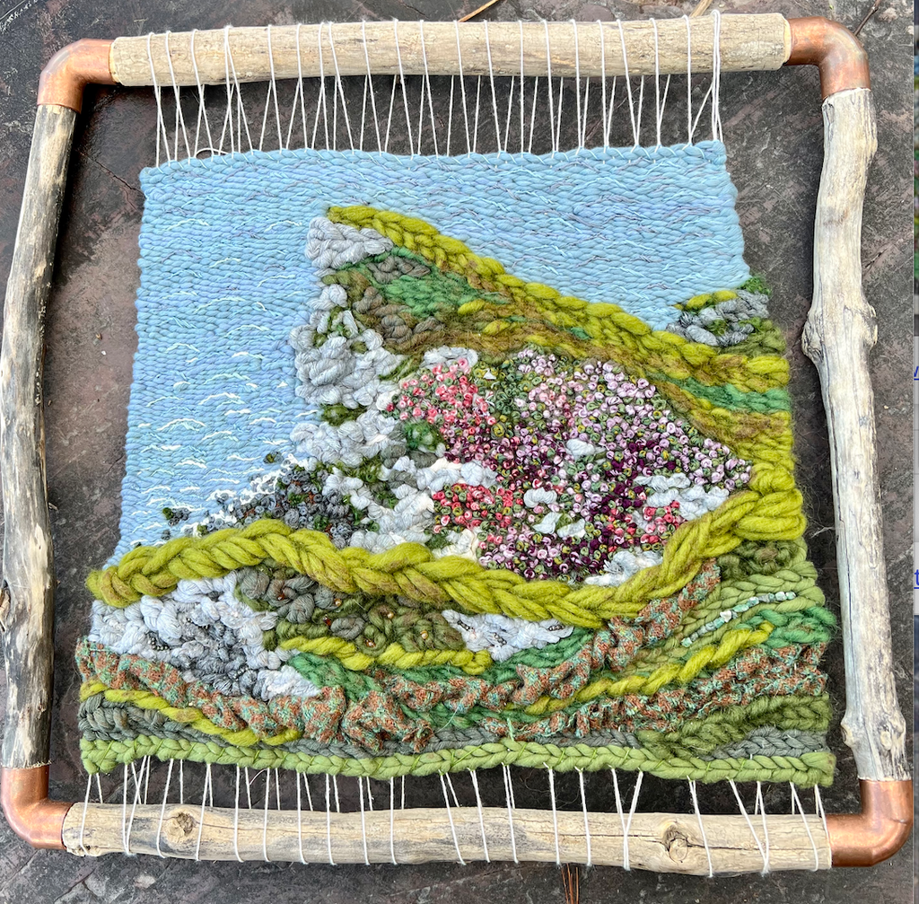 What Remains Woven Wall Hanging with Harris Tweed Hand Made Natural Paints Embriodery Pyrite Citrine Emerald in Driftwood and Copper frame inspired by Isle of Skye Cliff