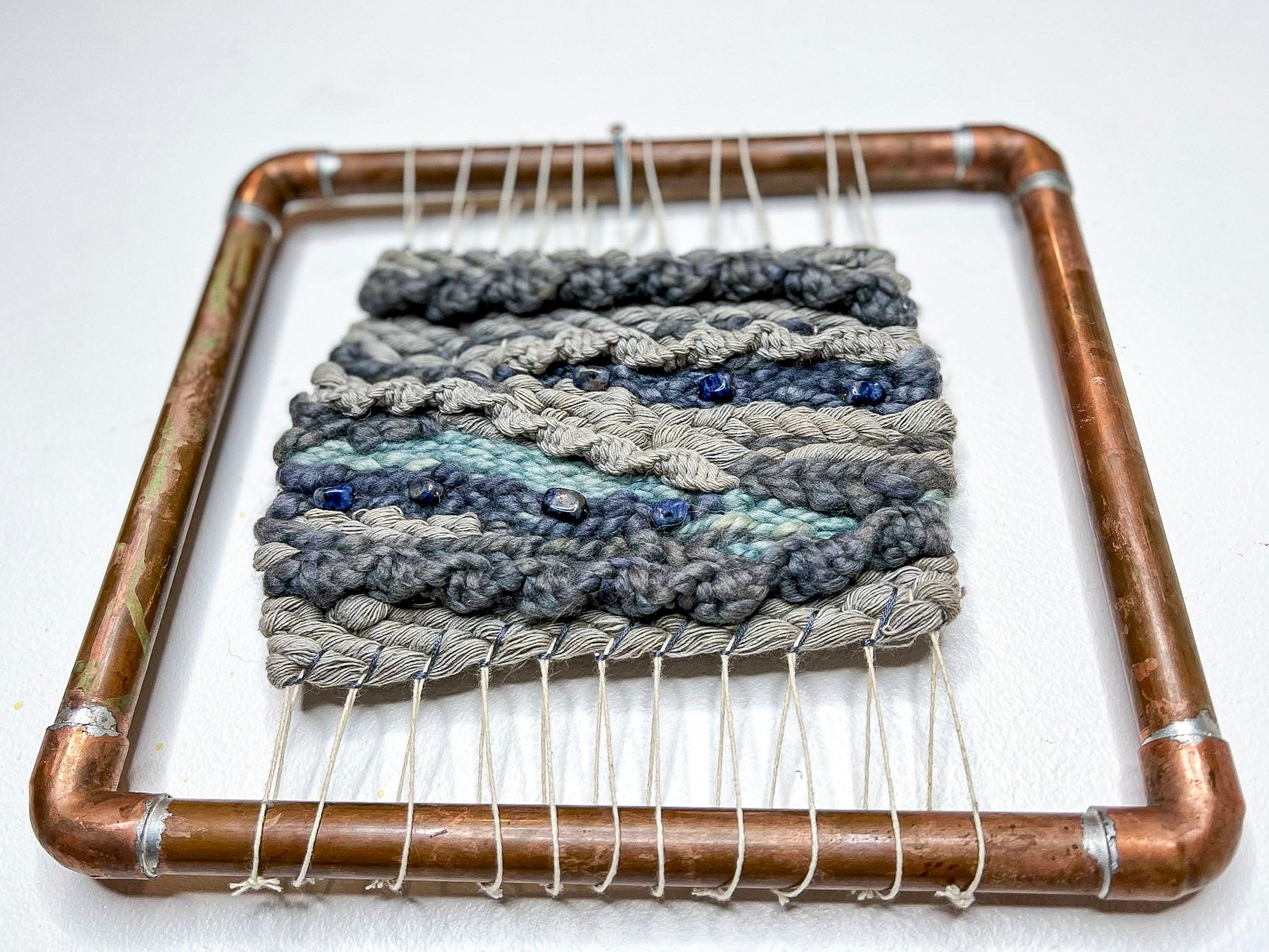 Naturally Dyed ancient Logwood and Indigo Woven Wall Hanging Tapestry with seven sodalite crystal beads in a custom copper frame from small woman owned business 