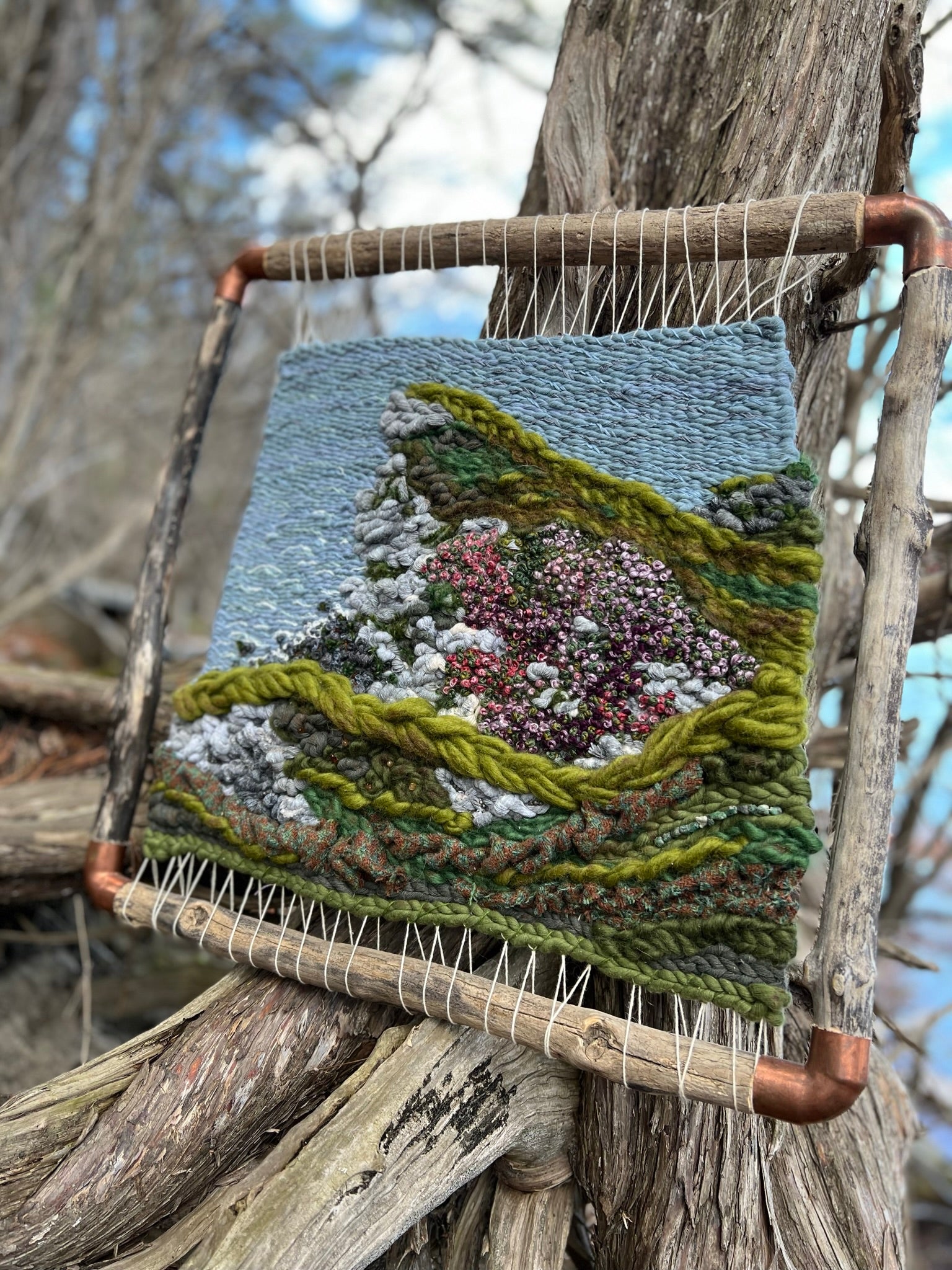 What Remains Woven Wall Hanging with Harris Tweed Hand Made Natural Paints Embriodery Pyrite Citrine Emerald in Driftwood and Copper frame inspired by Isle of Skye Cliff